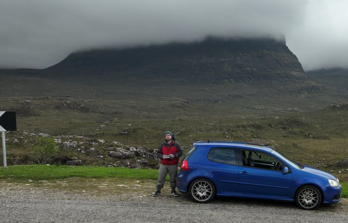 Tim beside his car in Scotland